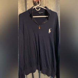 Navy blue golf polo with a zipper in the front